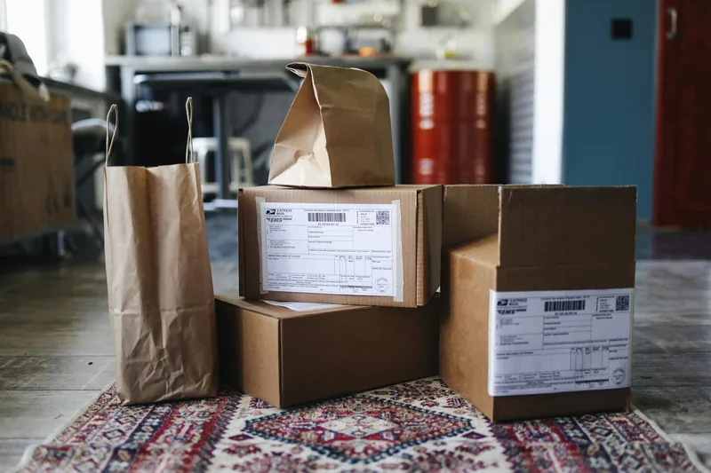 Online marketplace seller packing products in a warehouse for UAE delivery