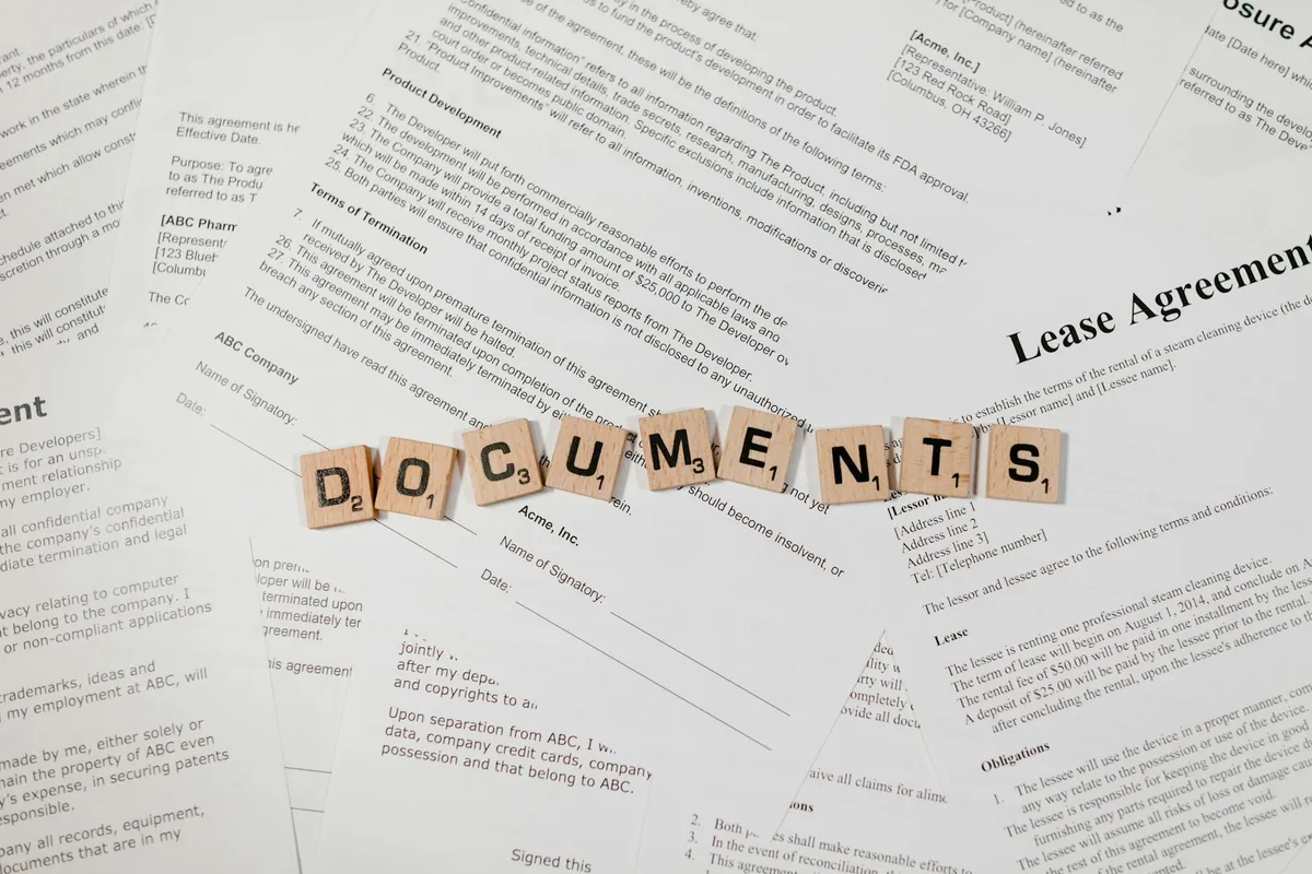 Malaysian online seller reviewing consumer protection law documents at a desk