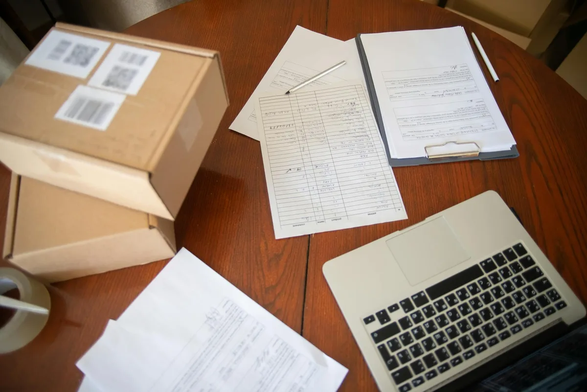 Malaysian ecommerce seller reviewing PDPA compliance documents at laptop